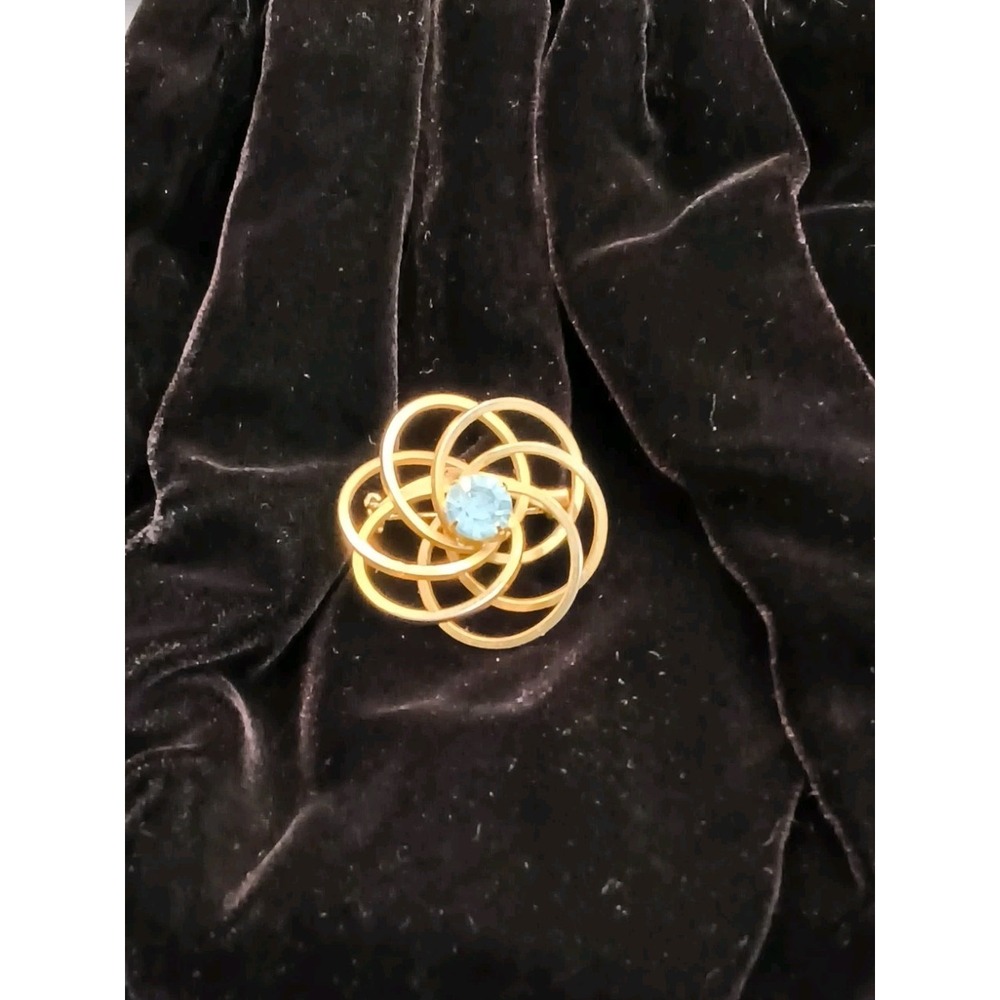 Vintage Mid-Century Gold Tone Atomic Swirl Brooch with Blue Rhinestone, 1950s.